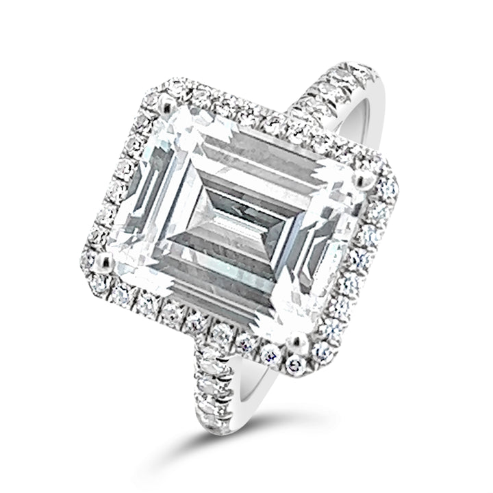 Dazzling Halo Engagement Ring Adorned with Pave Diamonds