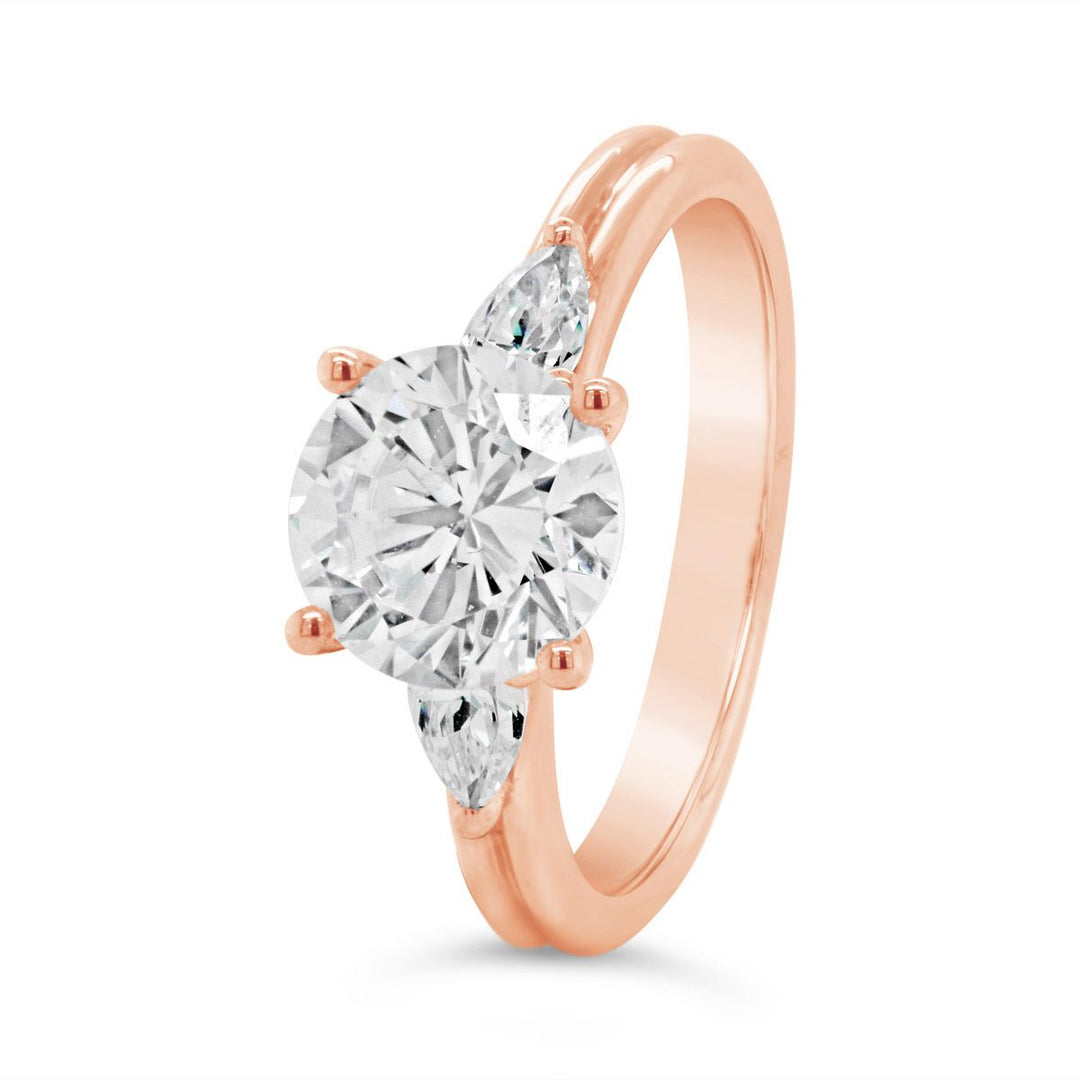 Three Stone Diamond Engagement Ring with Pear Shape Side Diamonds