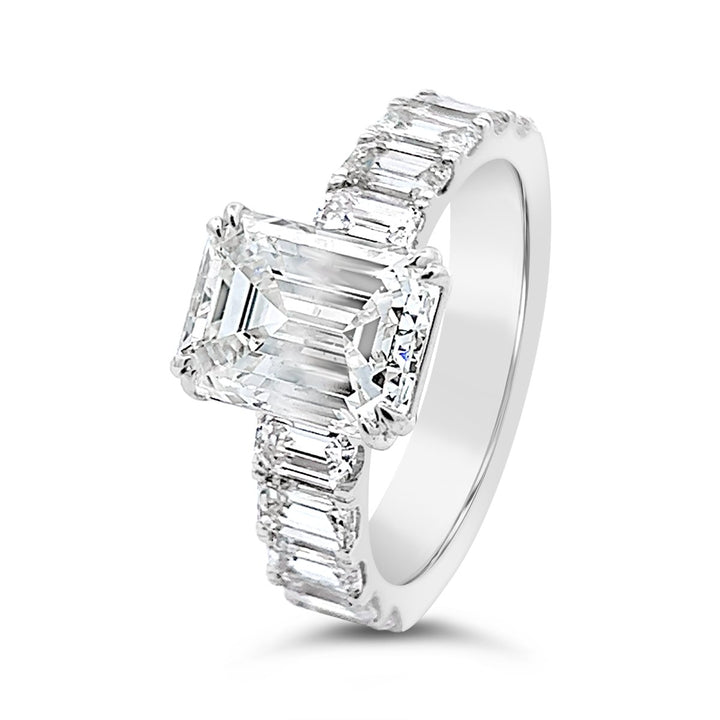 Modern Diamond Engagement Ring with Emerald side stones - The Diamond Guys
