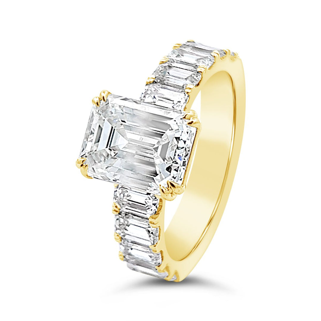Modern Diamond Engagement Ring with Emerald side stones - The Diamond Guys