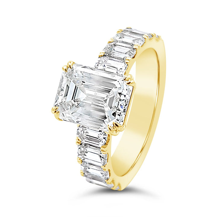 Modern Diamond Engagement Ring with Emerald side stones - The Diamond Guys
