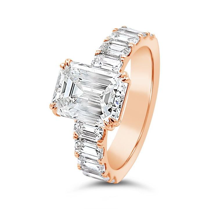 Modern Diamond Engagement Ring with Emerald side stones - The Diamond Guys