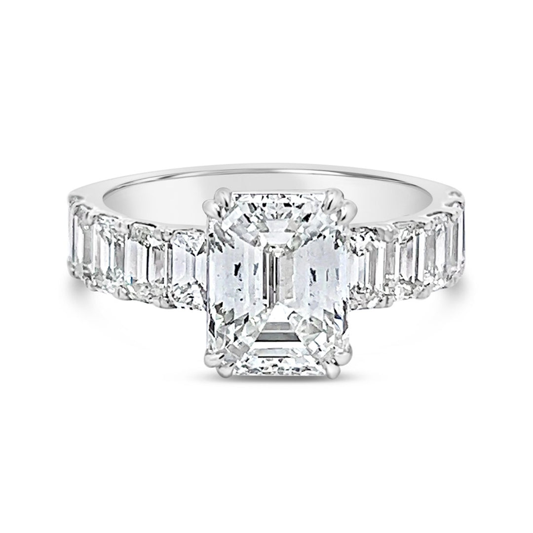 Modern Diamond Engagement Ring with Emerald side stones - The Diamond Guys